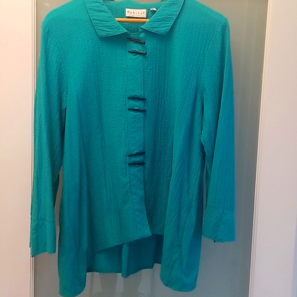 Beautiful turquoise blouse with wooden buttons